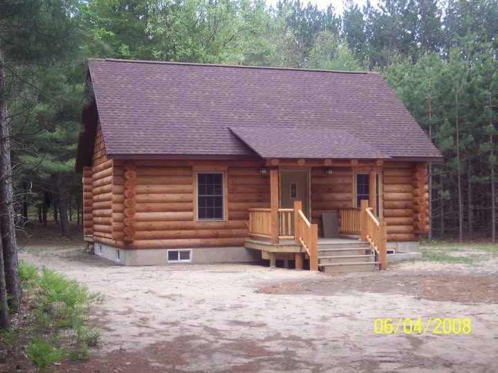 Finished Beaver Log Homes small log cabin with a covered front porch